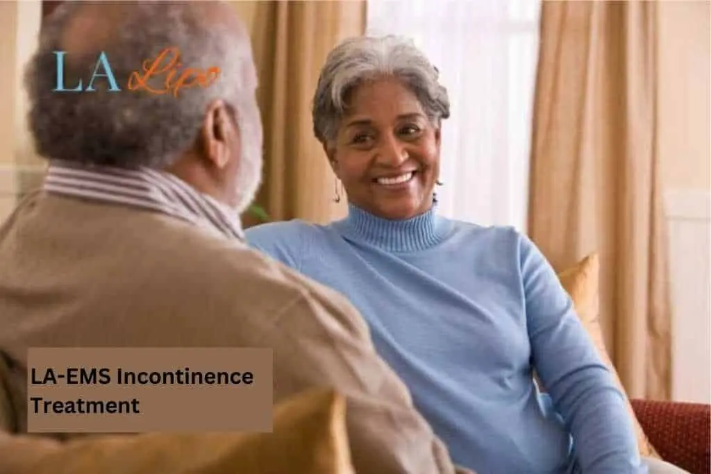 Couple sat smiling at each other - LA-EMS treatment Small Heath